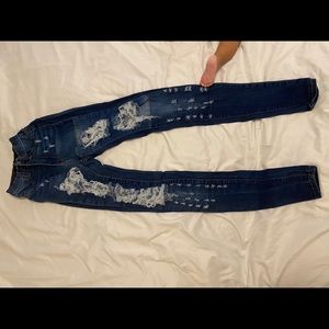 Dark blue distressed skinny jeans